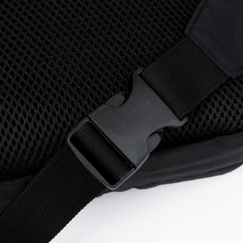 2. Close-up of adjustable strap and buckle on black Stinky Retro Waist Bag by Moomin