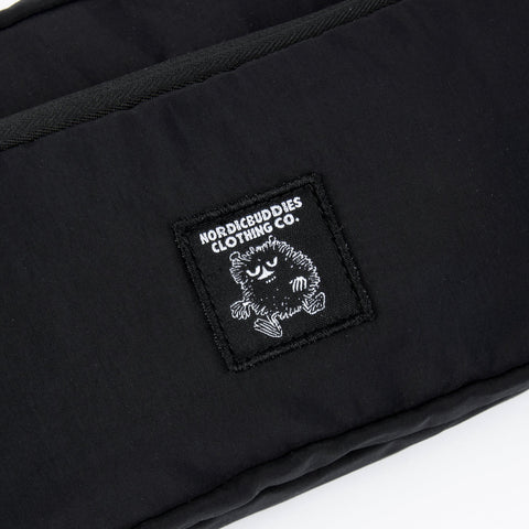 5. Close-up of NordicBuddies logo on black Stinky Retro Waist Bag by Moomin