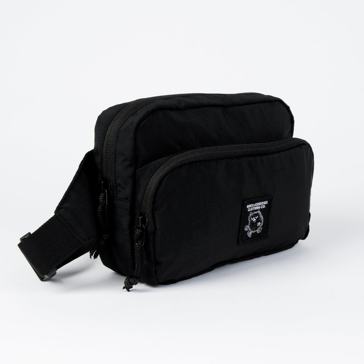 8. Side view of black Stinky Retro Waist Bag by Moomin highlighting dual compartments