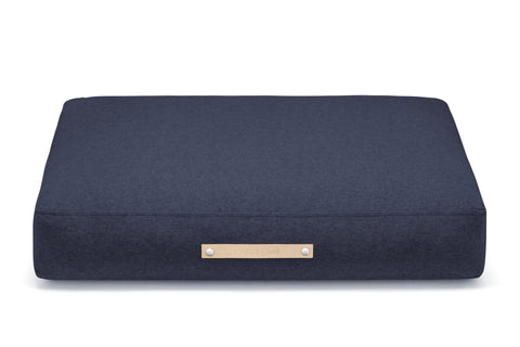 2. Labbvenn Stockholm cushion in navy blue with leather accent on clean white background