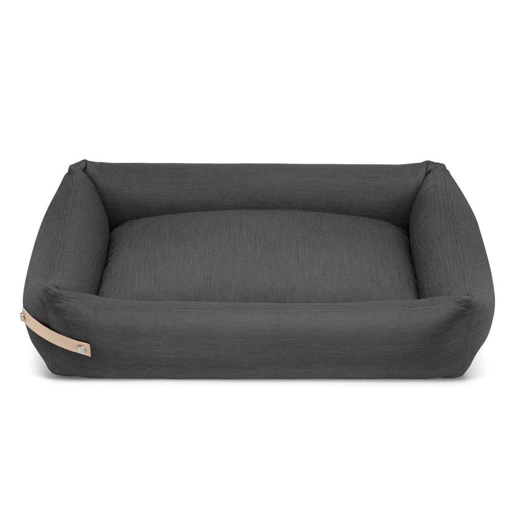 2. Grey Stokke dog bed by Labbvenn with leather belt detail, shown in studio setting highlighting spacious design and durable fabric