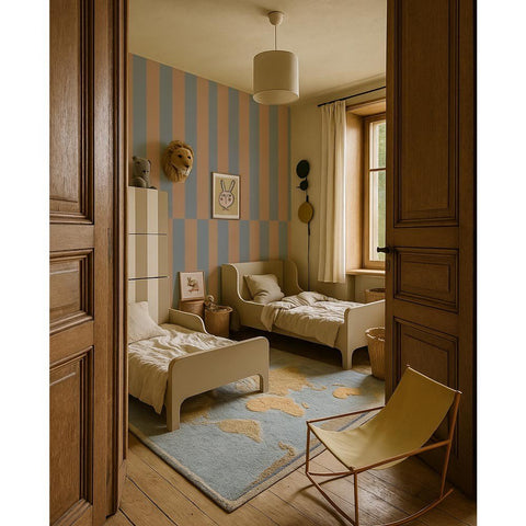 1. Children's room with blue and cappuccino striped wallpaper, two white beds, and light wood flooring, creating a warm and inviting atmosphere