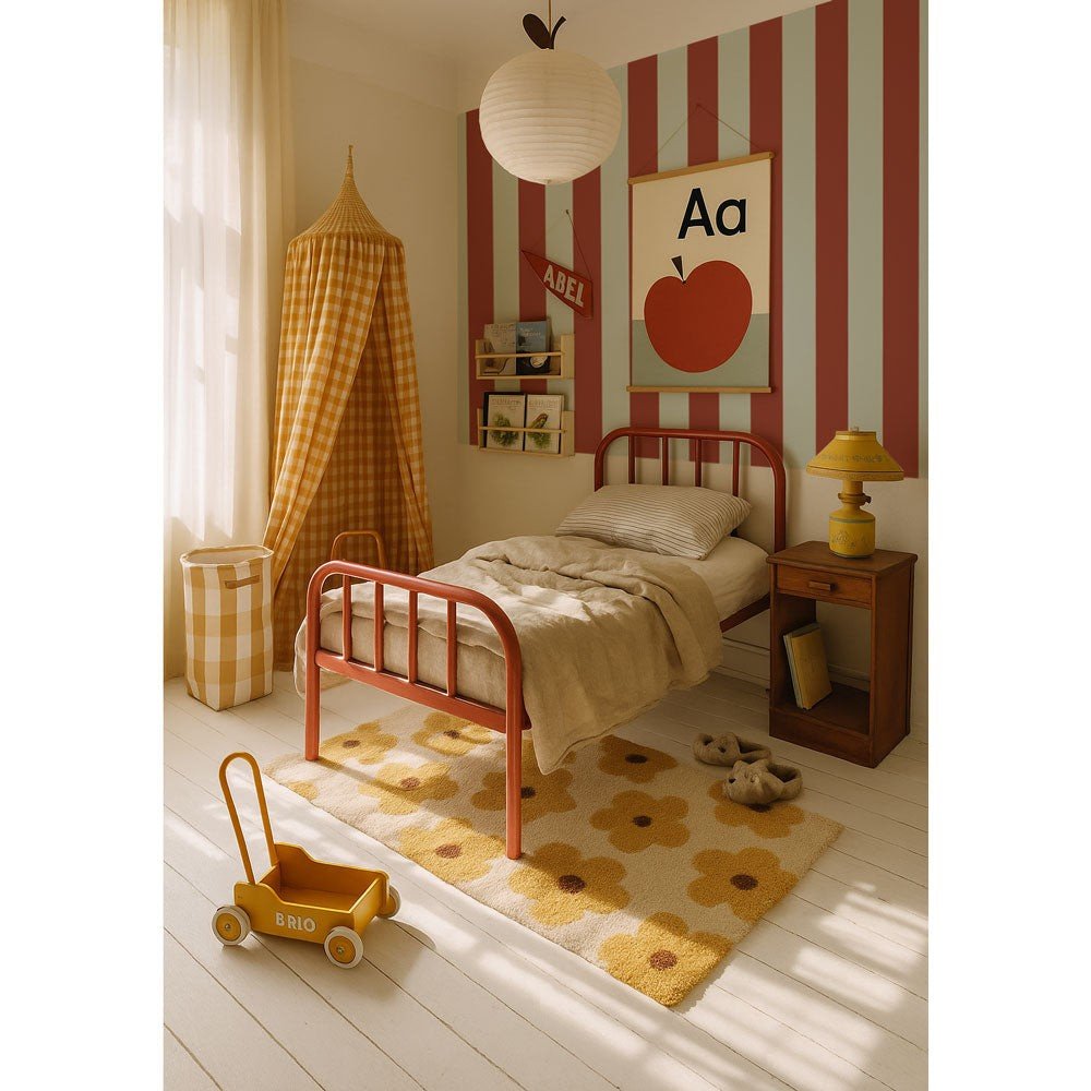 1. Children's bedroom with blue and dark red striped wallpaper, red metal bed, and yellow decor accents, creating a playful and cozy atmosphere