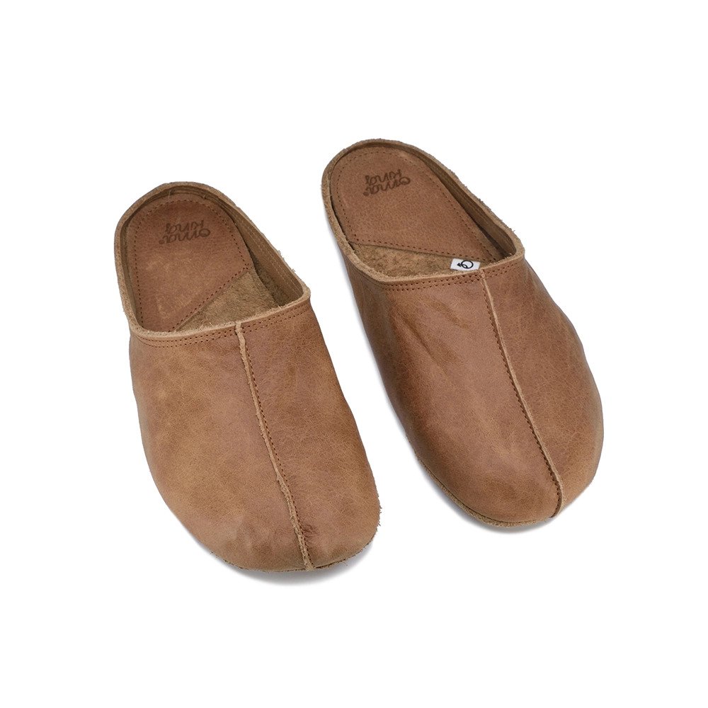 1. Unisex brown Sulbi recycled slippers by Omaking, shown in studio with wide toe area and natural leather finish