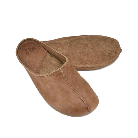 3. Unisex brown Sulbi recycled slippers by Omaking, displayed with leather-covered insole and suede outsole in studio