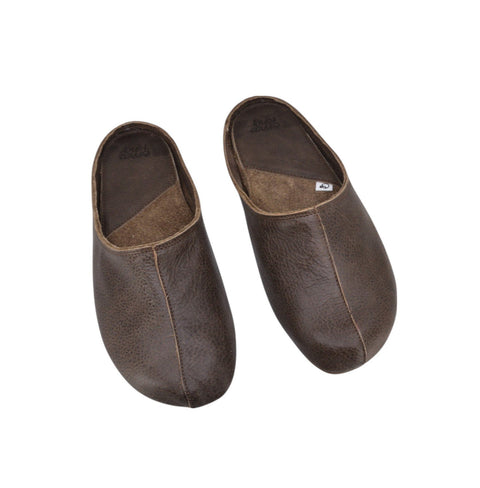 4. Flat lay of dark brown unisex leather slippers showing top view and wide toe design