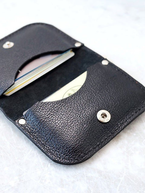 3. Close-up of black textured leather wallet by TOKS VISOKS with visible card slots