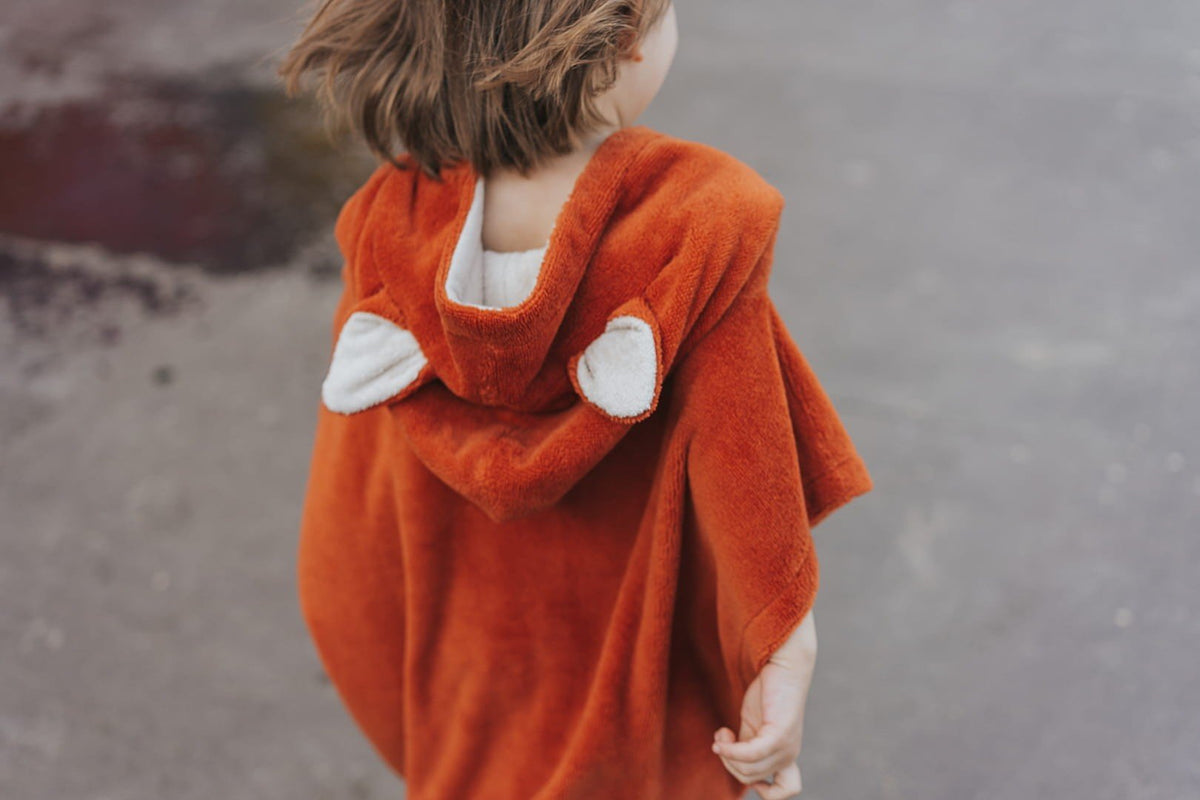 3. Close-up of orange Patulove Surffoxy kids bath poncho hood with ears, shown from back