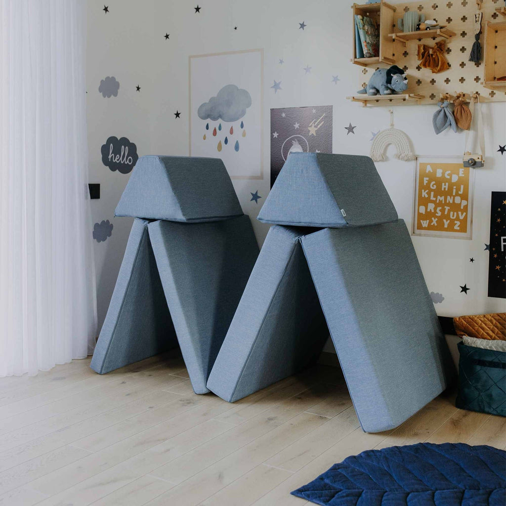 12. Two tent structures made from turquoise Monboxy play mattress set in a star-themed children's room