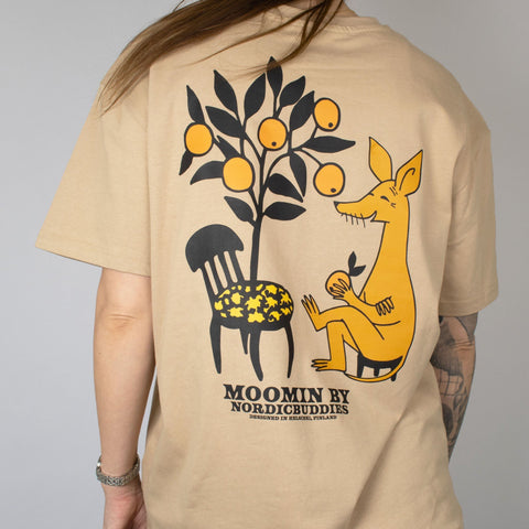 2. Unisex beige Moomin by NordicBuddies t-shirt with Sniff design, worn by female model, showing back graphic in lifestyle setting