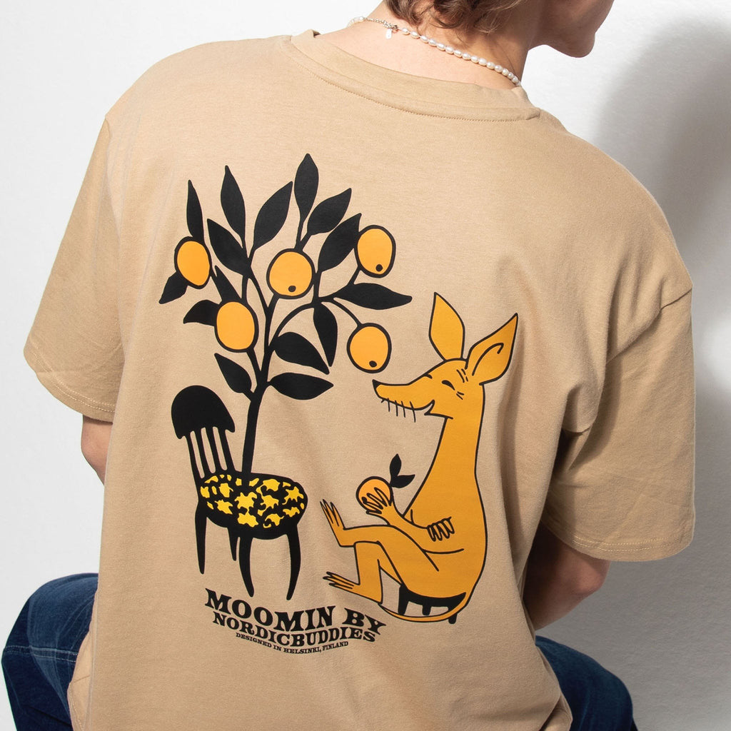 1. Unisex beige Moomin by NordicBuddies t-shirt with Sniff design, worn by male model, showing back graphic in lifestyle setting