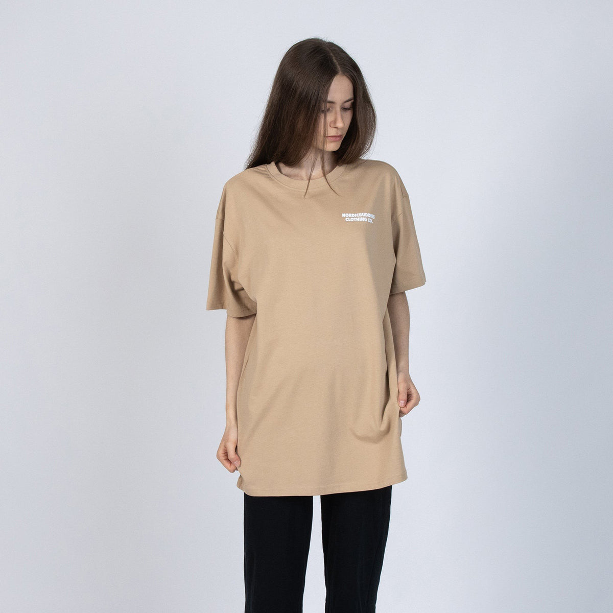 3. Women's beige Moomin t-shirt in studio, featuring relaxed fit and NordicBuddies branding
