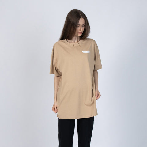 3. Women's beige Moomin t-shirt in studio, featuring relaxed fit and NordicBuddies branding