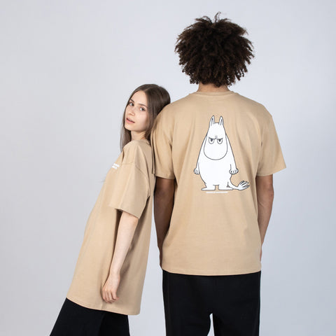 1. Unisex beige Moomin t-shirt worn by male and female models, showcasing oversized fit and back design in studio