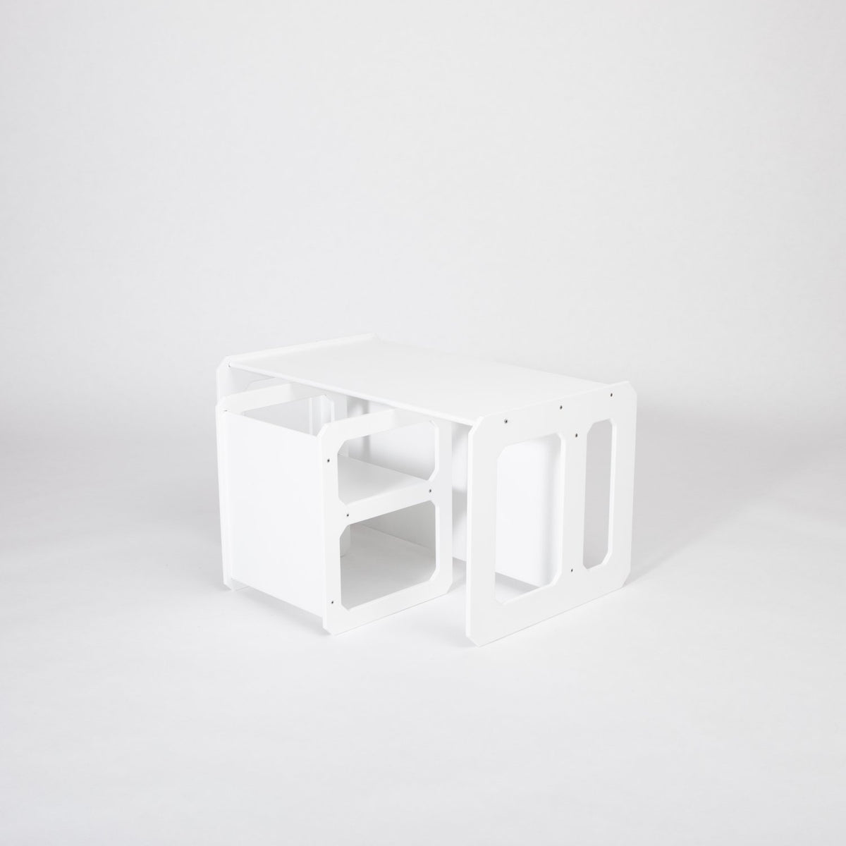 13. White Montessori weaning table and chair set shown from side on a white background