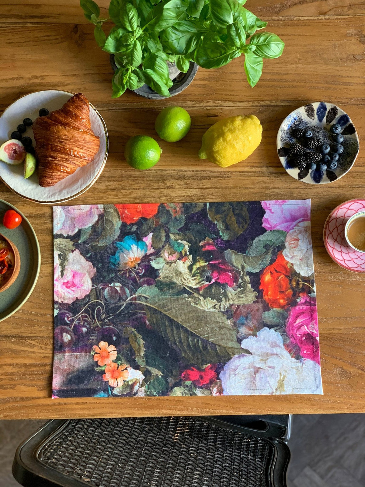3. Floral printed placemat on wooden table with breakfast items, highlighting intricate pattern and vibrant colors