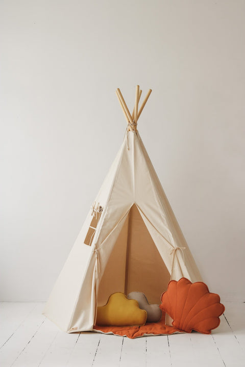1. Beige teepee tent with window and open entrance, decorated with orange and yellow cushions, in a studio setting