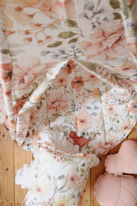 5. Close-up of floral fabric inside teepee tent with pink and white cushions