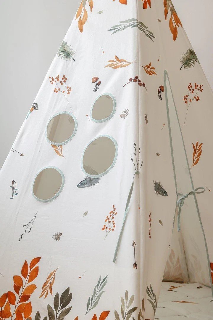 9. Detail of teepee tent with circular windows and forest pattern