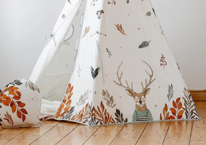 4. Close-up of teepee tent base showing deer and leaf pattern on wooden floor