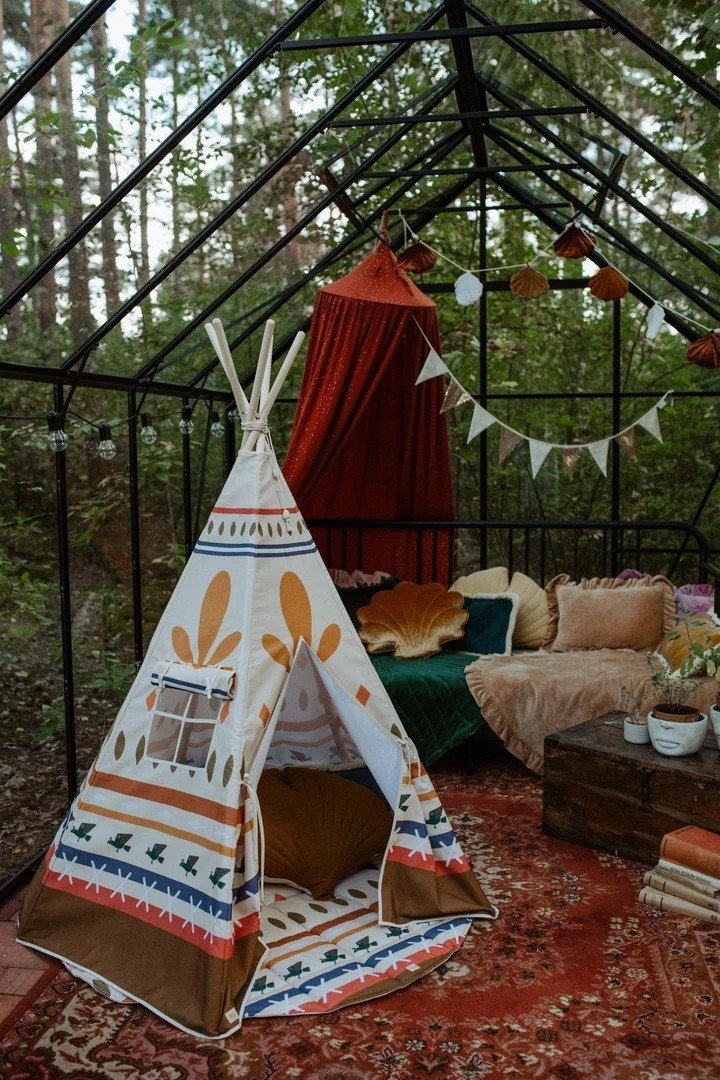 1. Children's teepee tent with Native Vibe print in an outdoor setting, surrounded by cushions and decor