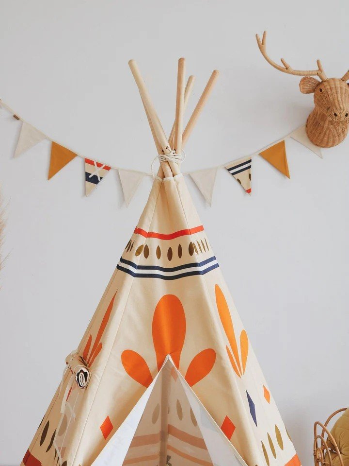 3. Close-up of teepee tent top with geometric prints and decorative bunting