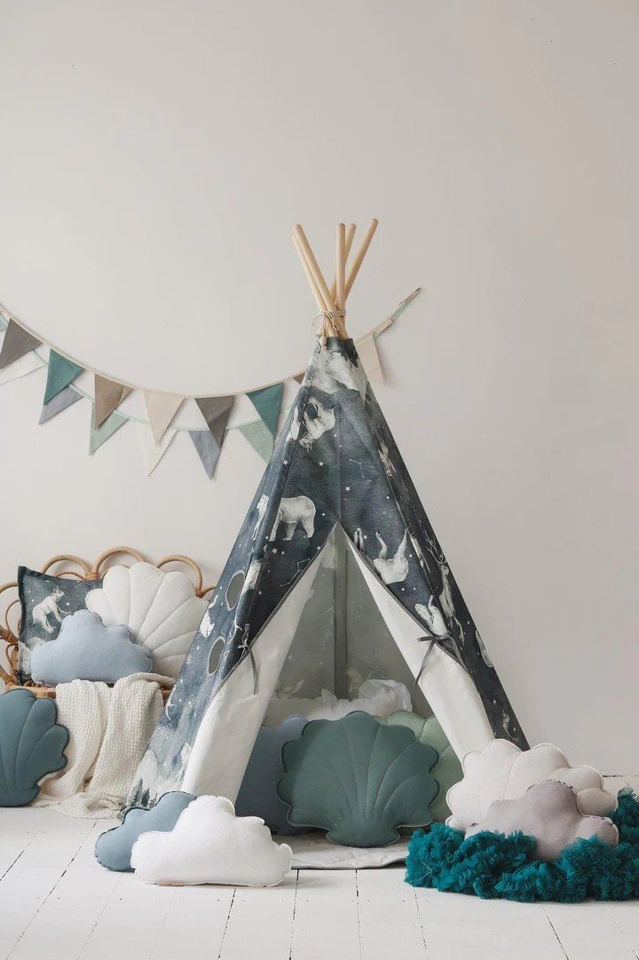 1. Cozy children's teepee tent with starry animal pattern, surrounded by decorative pillows and bunting in a playroom