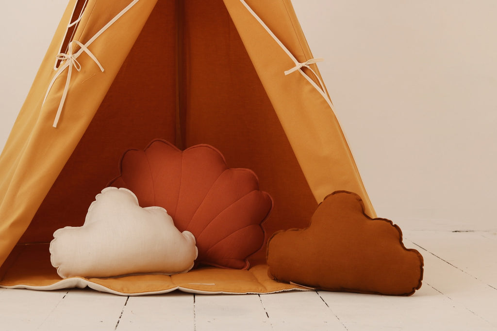3. Close-up of orange teepee tent entrance with decorative cloud-shaped pillows inside
