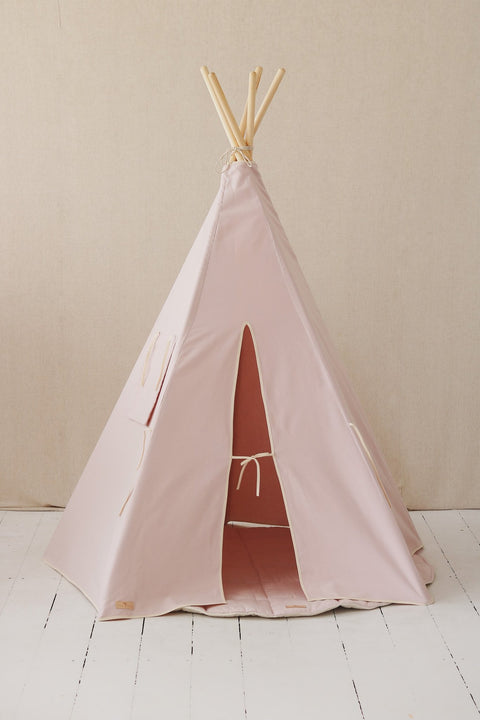 2. Pastel pink teepee tent with open entrance and pine poles on light wooden floor and beige wall