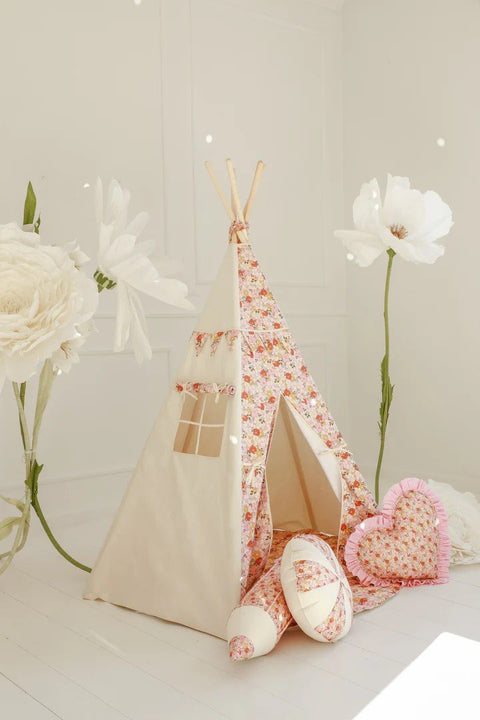 1. Children's floral teepee tent in a bright room with large white flowers, featuring a heart-shaped cushion