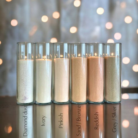 1. Assorted colored powdered candles by Candledust in glass containers, featuring Diamond Dust, Ivory, Pinkish, Sand/Bronze, Reddish, and Grey/Silver shades