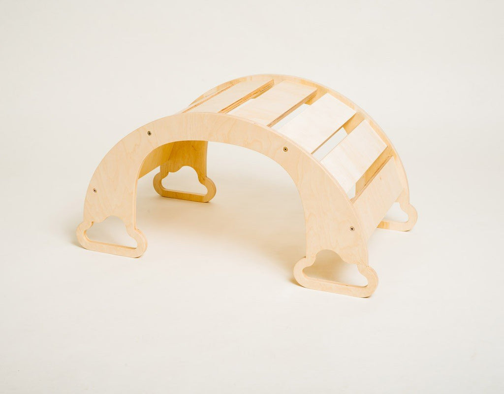 2. Side view of natural finish rainbow climber on a white background