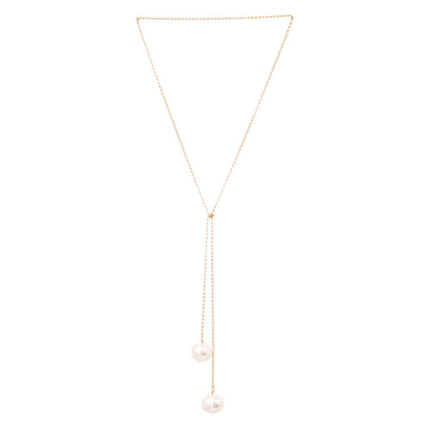 2. Studio image of TIED TO COCO - Pearl necklace by New Vintage by Kriss, showcasing two large pearls on a gold-filled chain