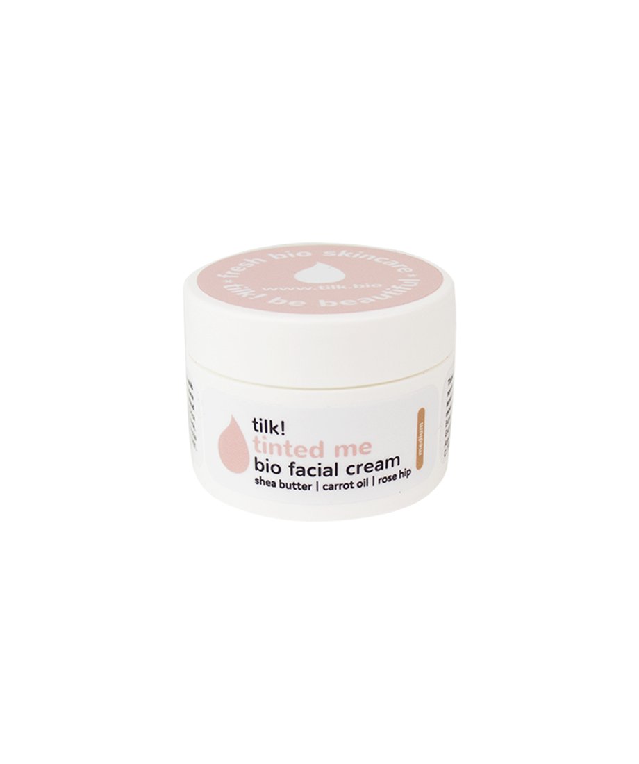 6. Tilk! Tinted Me bio facial cream jar featuring shea butter, carrot oil, and rose hip, ideal for nourishing skin