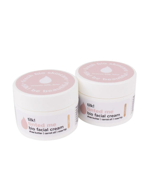5. Two jars of Tilk! Tinted Me BB cream, showcasing bio facial cream with shea butter and carrot oil
