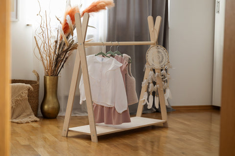 1. MeowBaby Tipi clothing rack in children's room with clothes and dreamcatcher, wooden floor