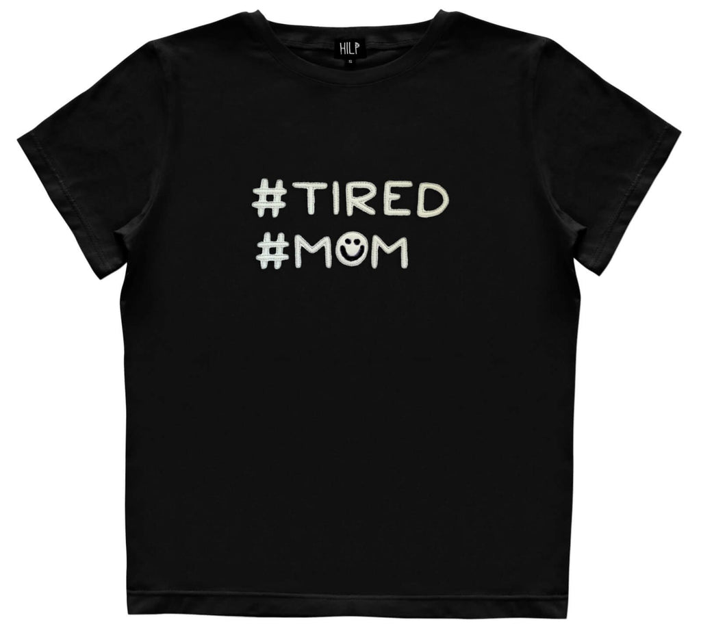 2. Black HILP Tired Mom T-shirt with hashtag design, shown in studio
