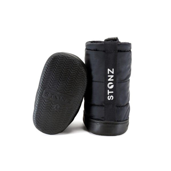 2. Back and sole view of black toddler puffer booties by Stonz, featuring non-slip rubber sole and brand logo