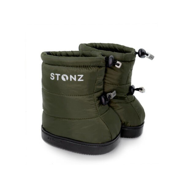 2. Stonz toddler puffer booties in cypress green with black non-slip soles and adjustable fasteners, shown in studio setting