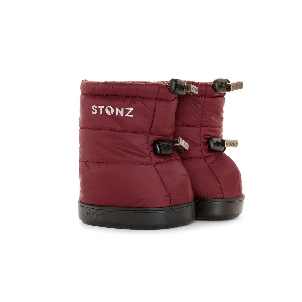 1. Pair of Stonz toddler puffer booties in ruby color with black soles and adjustable fasteners, shown in studio setting