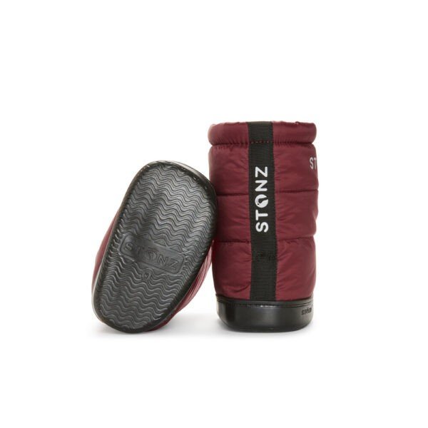 2. Stonz toddler puffer booties in ruby color showing non-slip rubber sole and back view with brand logo