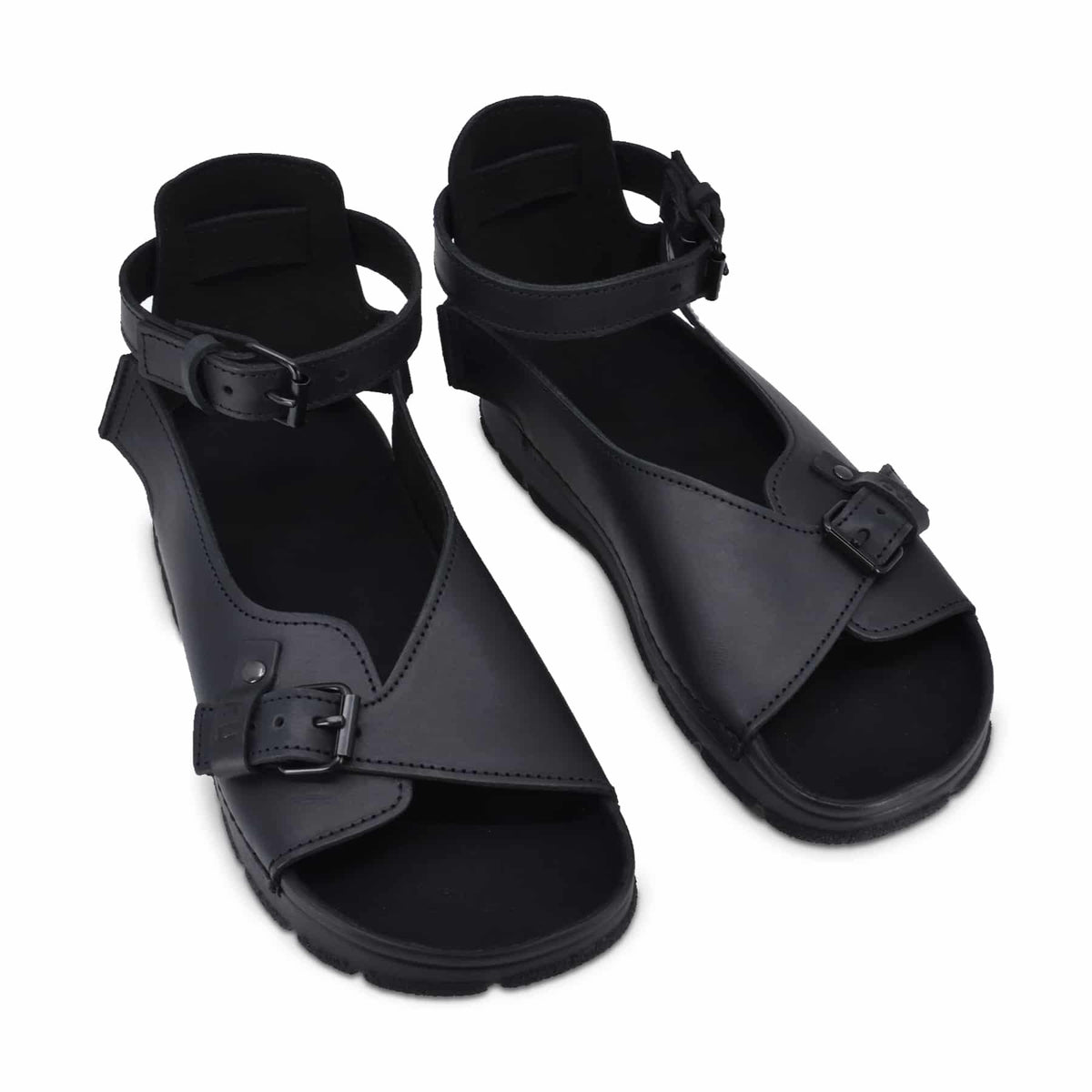 4. Studio image of TOKU Athens black sandals by Omaking, featuring closed heel design and adjustable straps