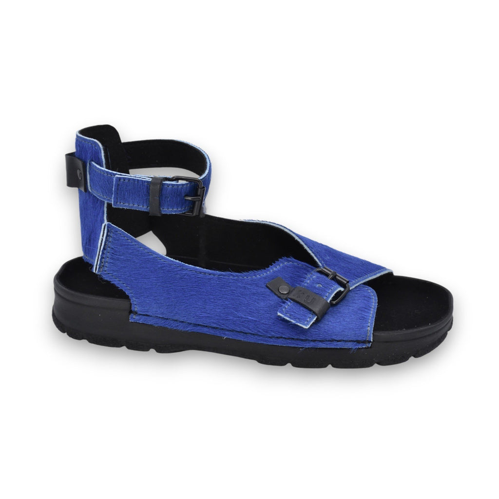 1. Omaking TOKU Athens blue sandals with closed heel and adjustable ankle strap, shown in side view