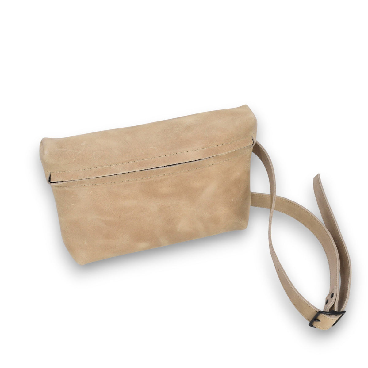 2. Studio shot of beige TOKU Lisbon bag by Omaking with adjustable buckle strap and zipper