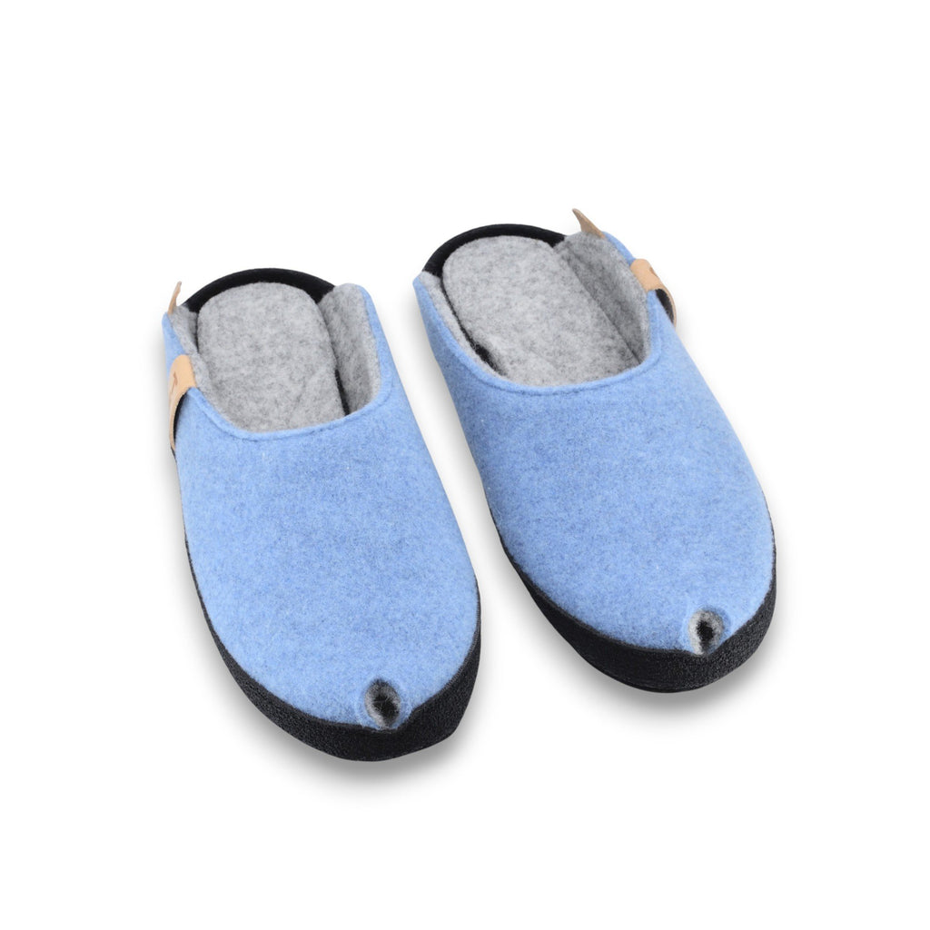 2. Pair of light blue TOKU Brussels slippers with black sole, shown from above, highlighting lambswool felt material