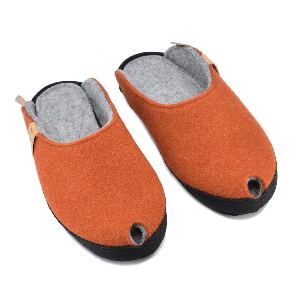 3. Pair of terracotta lambswool felt slippers with black sole, top view showing open back design