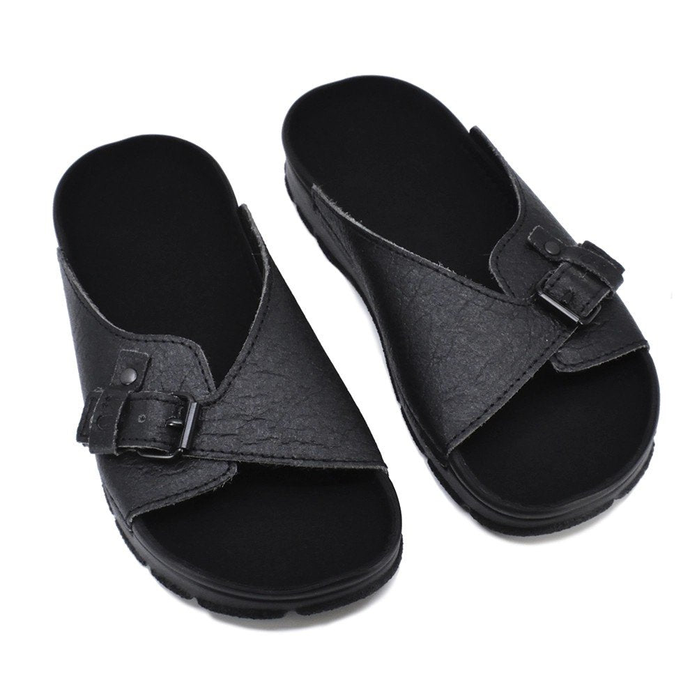 3. Pair of black TOKU Rome Vegan Sandals in studio setting, featuring adjustable straps and durable outsole