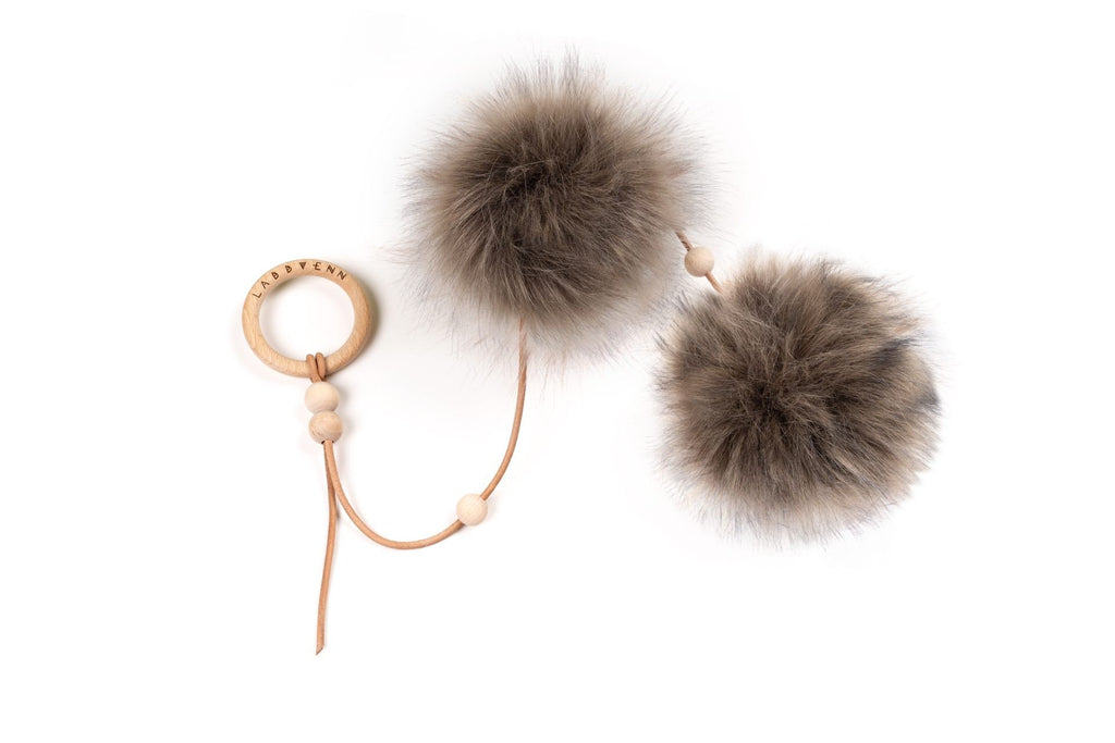 2. Labbvenn Tollo cat toy with two anthracite faux fur balls, natural leather string, and wooden ring on white background