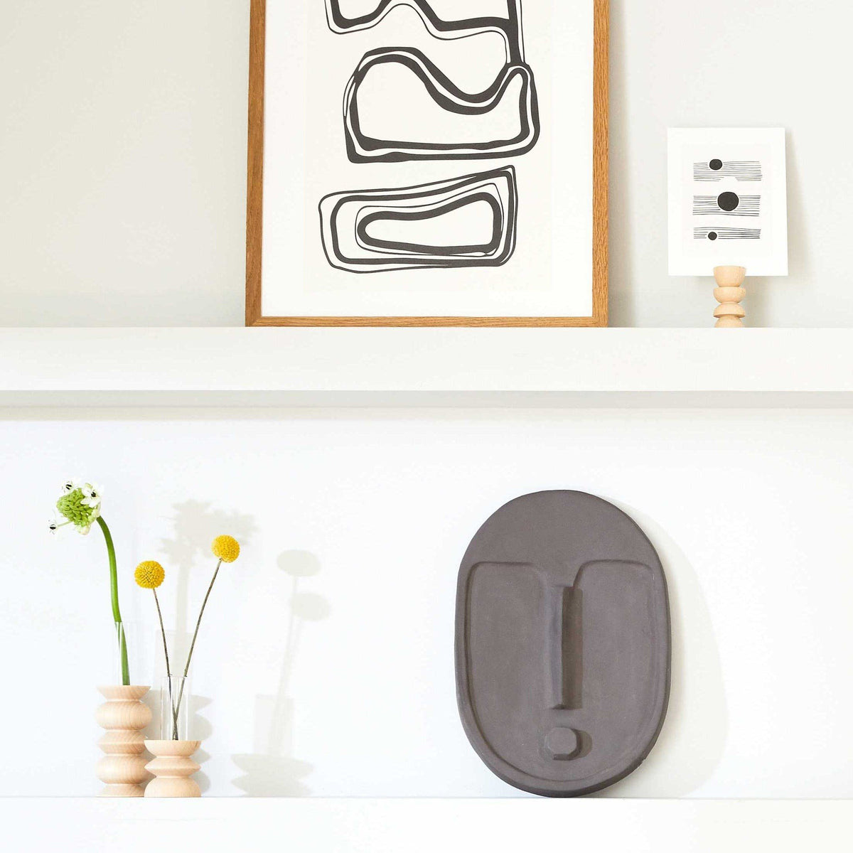 4. Totem Wooden Vase by 5mm Paper styled on a shelf with art and decor, lifestyle setting