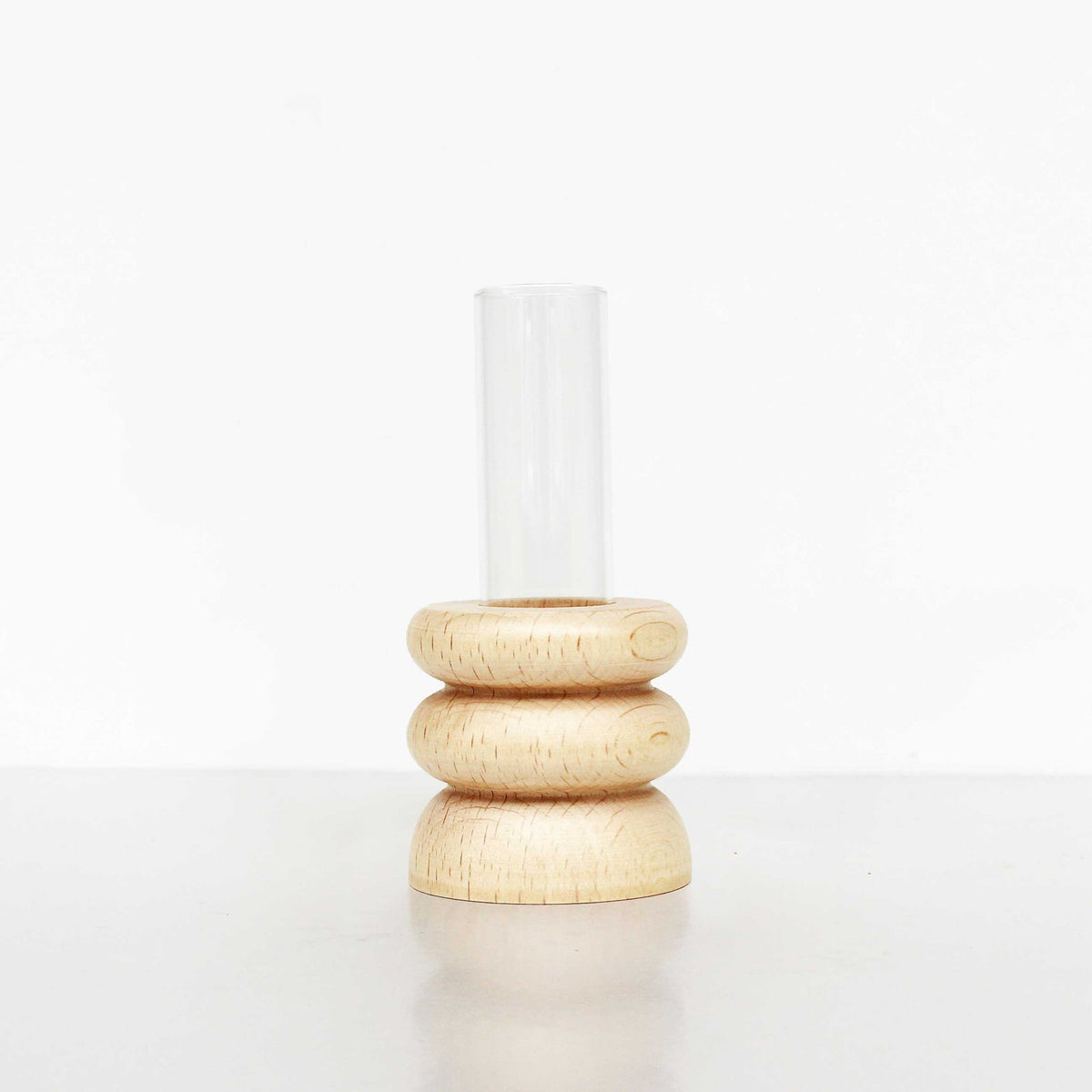 4. Studio shot of Totem Wooden Vase - Short Nº 1 by 5mm Paper showing beech wood base and glass tube